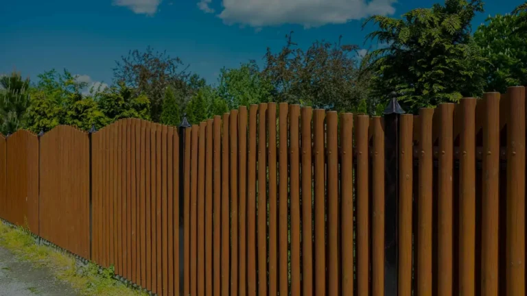 Stained board-on-board wood fence with overlapping pickets for full privacy