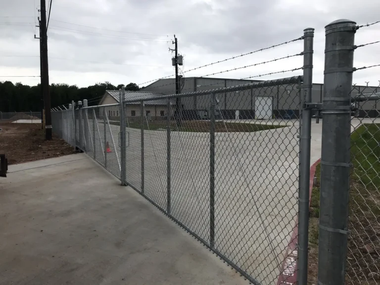Galvanized chain link security fence with barbed wire