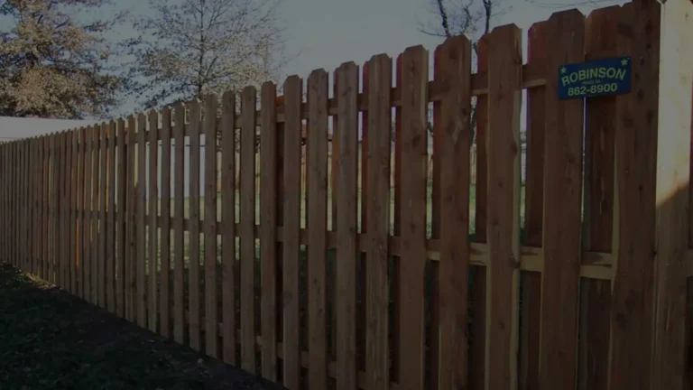 Shadowbox-style wood fence along a backyard property line